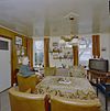 Interieur woonkamer met 72 jarige inwoner - Midlaren - 20328567 - RCE -  Interieur woonkamer met 72 jarige inwoner 