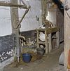 Interieur deel met waterpomp en werkbank - Midlaren - 20328584 - RCE -  Interieur deel met waterpomp en werkbank 