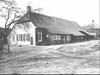 Overzicht voorgevel en zijgevel boerderij