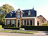 Woonhuis met aangebouwd kantoor