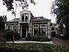 Woonhuis met aangebouwd koetshuis