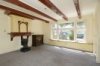 Interieur, overzicht woonkamer met schouw