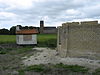 Victor (Wanswerd) under restoration, base and shelter.JPG -  Windmill Victor under restoration in 2012. The millers shelter and the brick base. Church of Wanswerd in the background