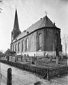 Exterieur overzicht naar het noord-westen - Kollum - 20126466 - RCE -  N.H. Kerk en Toren: exterieur overzicht naar het noord-westen 