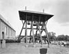 Overzicht klokkenstoel met schilddak op kerkhof - Wijnjewoude - 20345923 - RCE -  Hervormde kerk van Wijnjeterp: Overzicht klokkenstoel met schilddak op kerkhof (opmerking: Gefotografeerd voor Monumenten In Nederland Friesland, bladzijde 57) 