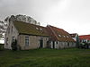Kinackers in Formerum op Terschelling -02 -  Farm from 1894 mostly intact with long house on the front side with simple six-paneled windows at Formerum Zuid 6 on the island of Terschelling in the Netherlands. Nationally listed heritage.  Vrij gave boerderij uit 1894 met lang voorhuis waarin eenvoudige zesruitsvensters, Formerum Zuid 6 op Terschelling..