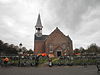 Kruiskerk in Midsland op Terschelling -02 -  Eastside entrance of the crudiform church at Westerburen 2 in Midsland on the island of Terschelling in the Netherlands, built in 1880 in eclectic style with neo-Renaissance elements on an elevated churchyard with cast iron fence. Nationally listed heritage.  Oostelijke zij-ingang kruiskerk te Westerburen 2 in Midsland op Terschelling gebouwd in 1880 in eclectische stijl met neo-renaissance elementen op een verhoogd kerkhof met hekwerk.