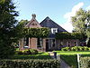 Kop-rompboerderij in roodbruine baksteen
