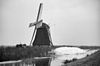 De Cornwerdermolen in de winter van opzij gefotografeerd - Cornwerd - 20047245 - RCE -  De Cornwerdermolen: De Cornwerdermolen in de winter van opzij gefotografeerd 
