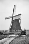 De Cornwerdermolen in de winter schuin van opzij gefotografeerd - Cornwerd - 20047243 - RCE -  De Cornwerdermolen: De Cornwerdermolen in de winter schuin van opzij gefotografeerd 