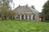 Boerderij, overzicht voorgevel met zesruits schuifvensters en luiken