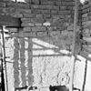 Scheuren in toren, onderste geleding in tufsteen buiten - Erichem - 20072074 - RCE -  Nederlands Hervormde Kerk: scheuren in toren, onderste geleding in tufsteen buiten 