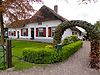 Gepleisterde boerderij, onder rieten wolfsdak