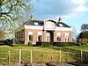 Bedum - hervormde pastorie -  Hervormde pastorie aan de Ter Laan 2 in Bedum. Gebouwd in in 1893 in eclectische stijl op de plek van de vroegere weem. In de gevel zit een steen met het opschrift 'Anno 1564', die vermoedelijk in 1802 uit de Walfriduskerk werd gehaald. Het afgeplatte tentdak is bedekt met Lucas IJsbrandspannen.