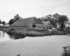 Overzicht achtergevels - Groningen - 20169194 - RCE -  Boerderij De Rollen, Noorddijkerweg 32, Noorddijk, gem. Groningen: overzicht achtergevels, gracht, 1974 