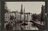 Stadsgezicht met kerktoren en vrachtschepen - Groningen - 20322690 - RCE -  De Hoge en Lage der A in Groningen. Kabinetfoto.)
