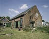 Achtergevel werkplaats met bouwsporen van aangebouwde loods