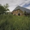 Groninger kop-hals-rompboerderij met bijschuur en stookhok