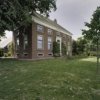 Overzicht van linker- en voorzijde woonhuis