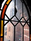 Toren van de Grote of Marktpleinkerk in Winschoten -  De toren vanuit een zolderraam van de kerk. In Groningen staan veel torens los van de kerk. In Winschoten is dat ook het geval. 
