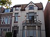 Vier woningen en een sociÃ«teitsgebouw met bovenwoning in Winschoten 1906 - 2