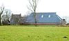 De Paddepoel - winter - zijkant -  Boerderij De Paddepoel aan de Paddepoelsterweg 5 (Adorp, Groningen, Nederland). De boerderij bevat gevelstenen met de jaartallen 1793 en 1855. 