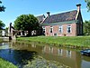 De Groene Klaver - voorhuis -  Voorhuis van boerderij en landgoed 'Pabema'. Links de stookhut. 