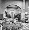 Interieur stationshal, bloemenwinkel - Weert - 20326120 - RCE -  N.S. Station: Interieur stationshal, bloemenwinkel 