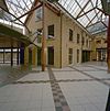 Exterieur overzicht winkelcentrum met overkapping - Bergen op Zoom - 20324466 - RCE -  Voormalig Gouvernement: Exterieur overzicht winkelcentrum met overkapping 