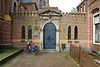 T.T Zandstenen Poort tussen RK Kerk en Pastorie st Laurentius Ulvenhout.JPG