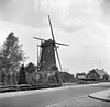 Ronde stenen beltmolen in vervallen staat schuin van voren gefotografeerd - Deurne - 20053794 - RCE -  Holten's Molen: Ronde stenen beltmolen in vervallen staat schuin van voren gefotografeerd 