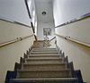 Interieur, trappenhuis en trap met terrazzowerk, van beneden naar boven bezien - Dongen - 20337022 - RCE -  Stoomfabriek En Schoenenfabriek Smits En Cie: Interieur, trappenhuis en trap met terrazzowerk, van beneden naar boven bezien 