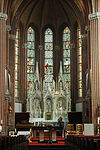 Martinuskerk-Tongelre-interieur-achterzijde -  Interieur van de Martinuskerk, Tongelre, Eindhoven, Nederland.  Inside St. Martin's Church, Tongelre, Eindhoven, the Netherlands. Composite of two images: one of the stained glass windows, one of the rest.