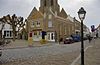 Voor- en zijgevel van de voormalige synagoge te Geertruidenberg; in de topgevel de Tien Geboden met Romeinse cijfers - Geertruidenberg - 20341865 - RCE -  Voormalige synagoge/ Synagoge (Elfhuizen 1): Voor- en zijgevel van de voormalige synagoge te Geertruidenberg; in de topgevel de Tien Geboden met Romeinse cijfers 