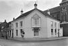 Herenhuis met gebosseerd gepleisterde gevels