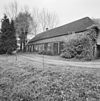 Exterieur overzicht zijgevel boerderij met dubbele inrijdeuren - Veghel - 20326067 - RCE -  Exterieur overzicht zijgevel boerderij met dubbele inrijdeuren 