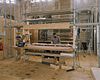Interieur- Overzicht houtatelier met restaurateur - Alkmaar - 20342285 - RCE -  Grote- of Sint Laurenskerk: Interieur: Overzicht houtatelier met restaurateur 