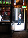 WLM - Minke Wagenaar - 09-07-01 Wijnand Fockink 005 - Proeflokaal voor likeur Likeurstokerij achter Krasnapolsky Pijlsteeg 31 Amsterdam Rijksmonument 4746 Pand met klokgevel (1689, afdeklijst XIX) met houten pui en winkelinterieur (XVIII). Wijnand Fockink Pijlsteeg 43 1012 HH Amsterdam 020 6392695 