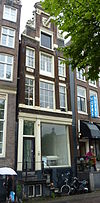 Pand met pilaster-halsgevel met tussentrappen