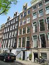 Huis, vanwege de voorgevel die een kopie is van de oorspronkelijke en de originele onderdelen van de gevelhals draagt