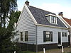 Houten dwarshuis met achteraanbouw