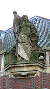 Nationale Levensverzekeringbank Johan SchrÃ¶der Koningsplein Amsterdam -  Sculpture on top of the building of the Nationale Levensverzekeringsbank at the Koningsplein 11 in Amsterdam. The sculpture was made by Johan SchrÃ¶der. De building was a design by architects J.G van Gendt and A.D.N. van Gendt in 1911 - 1912. 
