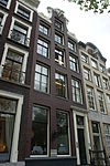 Pand met klokgevel met vier louis