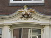 Detail Nieuwe Leliestraat 49 -  Houtversiering Nieuwe Leliestraat 49, Amsterdam