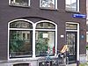 Huis uit 1642/43 verenigd achter een gezamenlijke lisenengevel met de nrs 151, 153