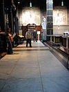 WLM - Minke Wagenaar - Sint Nicolaaskerk 10 - De Sint Nicolaaskerk is de derde Amsterdamse kerk op rij die werd gewijd aan de patroonheilige van de stad. Sint Nicolaas was schutsheilige van de zeevaarders en werd daarom ook vaak als patroonheilige van havensteden gekozen. Het ontwerp van de kerk is van architect A.C. Bleys; de plechtige wijding volgde op 7 februari 1887. Als rooms-katholieke hoofdkerk van Amsterdam moest het gebouw een bijzondere allure uitstralen. Bleys gaf de kerk een neobarok uiterlijk met twee torens en hoge koepel als…