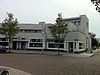 Zuidwestelijke reeks winkels en bovenwoningen