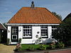 Huis met bijzondere schoorsteen (smuiger)
