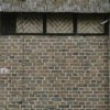 Detail oostgevel: vakwerk met metslewerk in visgraatmotief