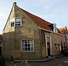 Gerend hoekpand onder dwarskap